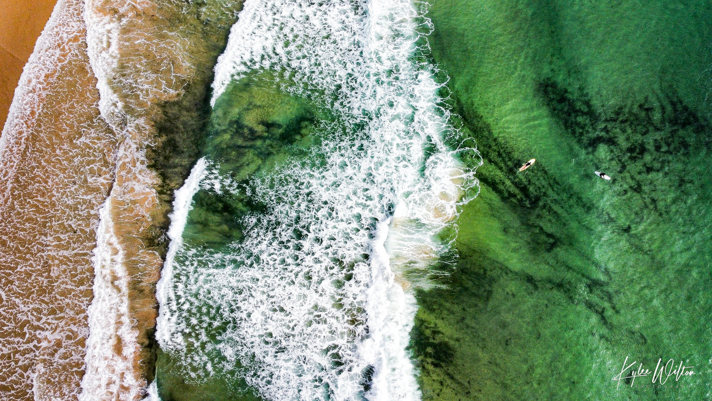 One Mile Beach surfers battling seaweed and black sand, Port Stephens, Australia, in December 2024.